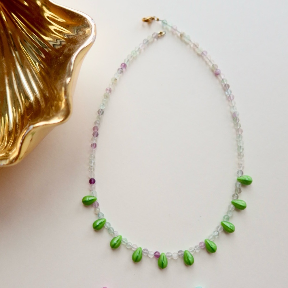 Necklace with translucent fluorite pearls and grass-green glass bead